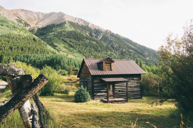 Small log cabin in the mountains